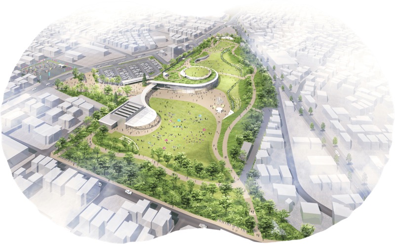 桑都の杜の園内を上空から見た完成イメージ。中央に円形の芝生広場と弧を描く本館、左上に駐車区画が並ぶ駐車場、周囲は街路樹と市街地
